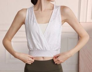 Detail view of white nylon jacquard gym vest featuring a deep V-neck and inner lining