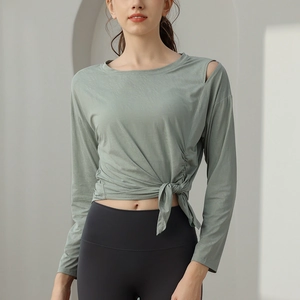 Women's emerald jacquard yoga top with shoulder cutout and side knot tied waist detail
