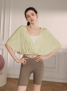 Detail of light green breathable jacquard mesh yoga cover-up with stylish batwing sleeves