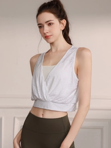 White V-neck jacquard sports tank top with layered design and olive green leggings