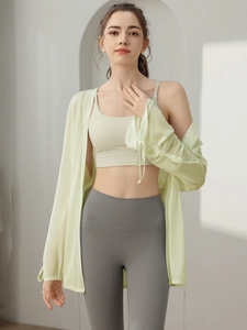 Women's light green loose yoga cover-up jacket with long sleeves and drawstring details