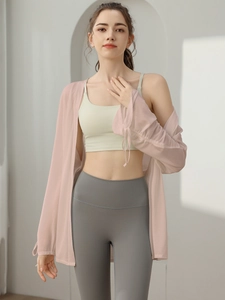 Three-piece yoga set with sports bra, high waist leggings and a sheer pink cardigan