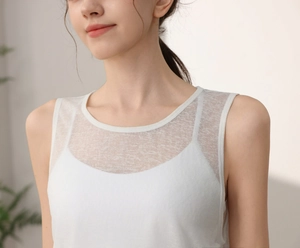 Close-up of white sheer mesh yoga tank top with breathable nanosilk texture