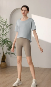 Detail of light gray loose-fit dry-fit sports t-shirt paired with khaki cycling shorts
