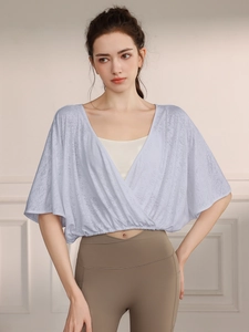 Light blue jacquard yoga top with breathable batwing sleeves and cross-wrap design
