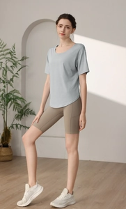 Women's light blue camo burn-out sports tee with high-waist khaki biker shorts outfit