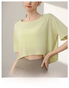 Detail of loose tencel crop top t-shirt in light yellow for yoga and fitness training