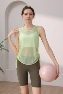 Detail view of light green mesh yoga tank top with side drawstring design for active women