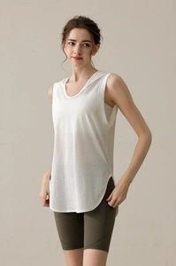 Detail of loose fit white hooded vest and green cycling shorts for fitness workout