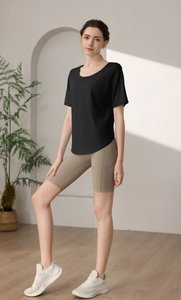 Detail of loose fit black quick-dry camo burnout sports T-shirt with grey yoga shorts