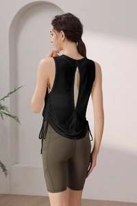 Back view of black mesh yoga tank top with open slit and drawstring details