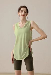 Detail showing loose light green sleeveless gym vest with curved hem and knit texture