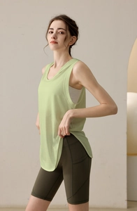 Detail of loose fit sleeveless workout top and biker shorts with side pockets