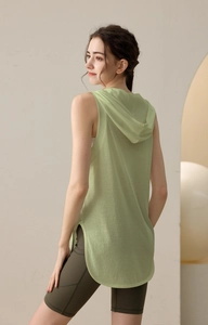 Detail of light green hooded sports vest with side slits and breathable fabric