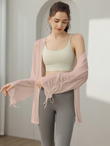 Pink sheer yoga mesh jacket with drawstring sleeves and white sports bra outfit