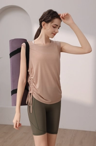 Detail of tencel sports vest with side drawstrings and high-waist cycling shorts