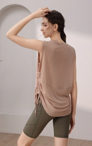 Detail view of adjustable side drawstrings on a slim fit breathable yoga tank top