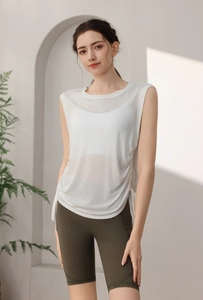 Detail view of white yoga tank top with side drawstrings and breathable mesh fabric