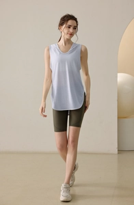 Detail view of mauve sleeveless yoga hoodie with side slits and curved hemline