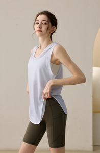 Detail of light purple loose workout tank top with deep armholes and side slit detail