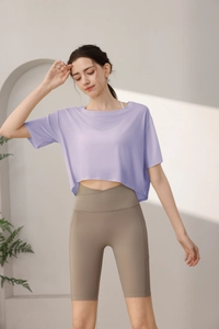Detail of loose lavender short-sleeved tencel sports top and khaki fitness shorts