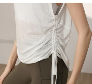 Detail of white breathable workout top with adjustable side drawstring ruching