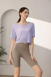 Detail view of Tencel sports crop top with high-waisted fitness shorts and side pocket