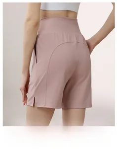 Detail view of pink high-waisted gym shorts featuring seamless stitching and lifting design