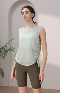 Detail view of mint green tencel sports vest with side drawstring and ruched design