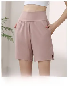 Detail view of high-waisted shorts featuring convenient side pockets and split hems