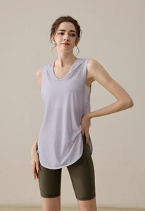 Detail of light purple hooded yoga vest with a curved hem and breathable fabric