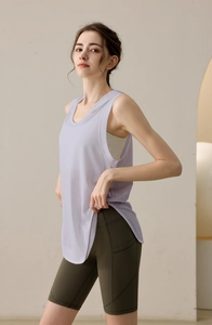Detail of lavender loose fit sports tank top and olive green high waist yoga shorts