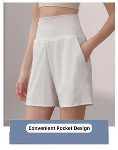 Detail of white high-waisted shorts featuring practical side pockets for sports