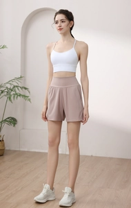 Detailed view of high-waisted grey-pink yoga shorts with wide tummy control waistband