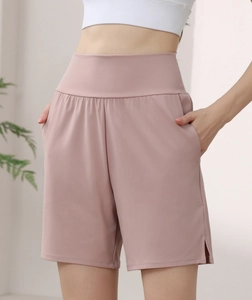 Close-up of high-waist yoga shorts with side pockets and smooth athletic nylon fabric