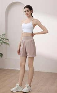 Detail view of high-waisted sports shorts with a convenient side pocket for yoga and fitness