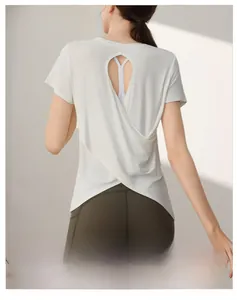 Detail view of back cutout and cross design on modal white yoga fitness t-shirt