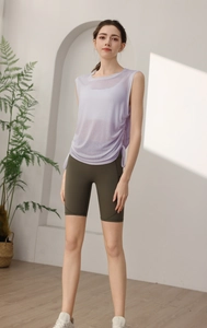 Detail view of light purple yoga tank top with side drawstring and dark green cycling shorts
