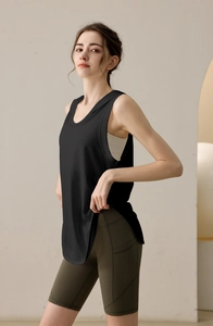 Detail view of loose sleeveless sports hoodie and high waist cycling shorts with side pockets
