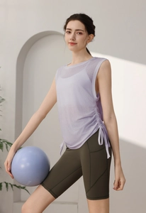 Detail view of purple yoga tank top with functional side drawstrings for adjustable shirring