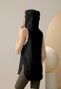 Detail of loose black hooded gym vest with side slits and soft knit fabric for women