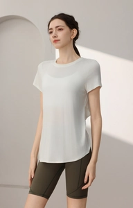 Detail of white modal sports tee featuring a curved hem and lightweight breathable fabric