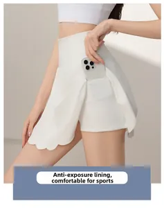 Detail view of scalloped edge white tennis skirt with phone pocket and inner lining