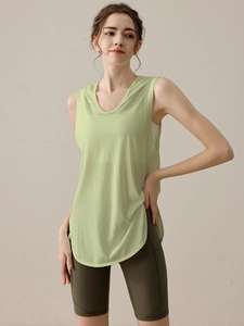 Women's loose fit hooded sports vest and green cycling shorts set for gym and yoga workout