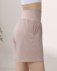 Close-up of side pocket and high-waist design on mauve quick-dry sports shorts