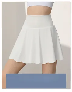 Close-up of white high-waisted petal yoga skirt with stylish wavy hem design