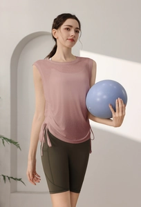 Detail view of pink tencel sports vest with drawstring side and breathable mesh fabric