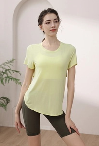Detail of light yellow modal sports t-shirt showing breathable fabric texture and curved hem
