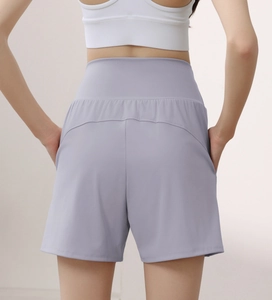 Rear view of high-waisted lavender yoga shorts for women featuring seamless lifting effect