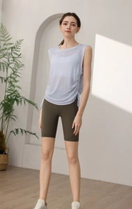 Detail of light blue quick-dry yoga tank top with side drawstring and breathable mesh fabric
